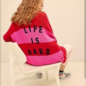 Lazy Oaf ‘Life is Hard’ Cardigan in Pink and Red.